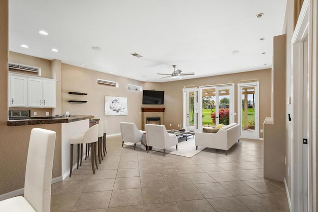 tiled living room with ceiling fan