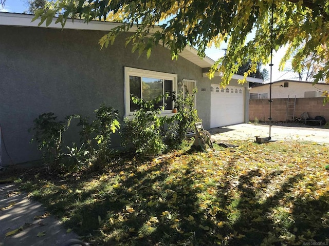 view of side of home with a garage