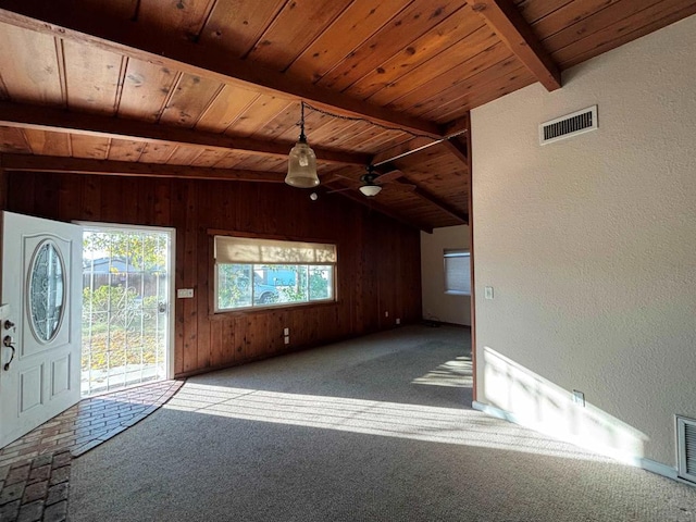 unfurnished living room featuring ceiling fan, wooden ceiling, light colored carpet, and vaulted ceiling with beams