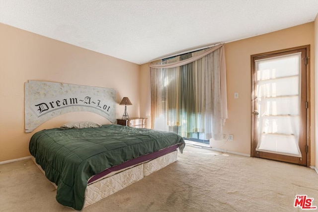 bedroom with carpet flooring, vaulted ceiling, a textured ceiling, and multiple windows