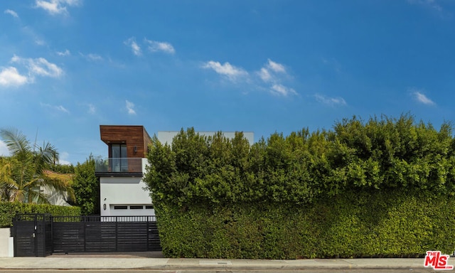 exterior space with a balcony and a garage