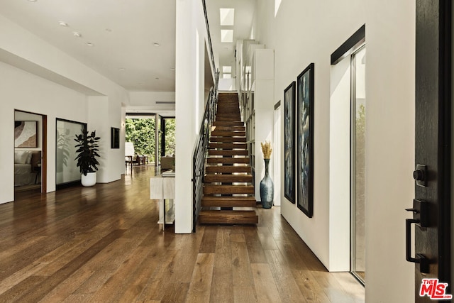 stairway featuring hardwood / wood-style floors