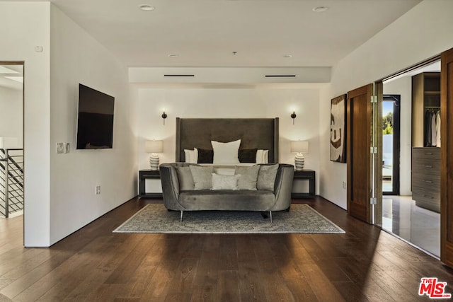 bedroom with dark wood-type flooring