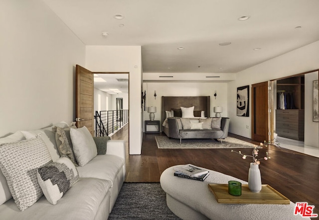 bedroom with dark wood-type flooring