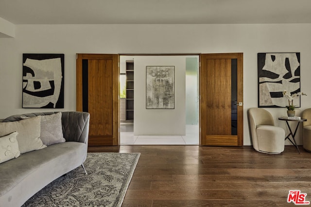 living room with dark hardwood / wood-style flooring