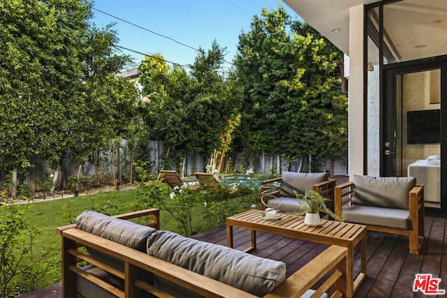 view of patio / terrace featuring an outdoor living space and a wooden deck