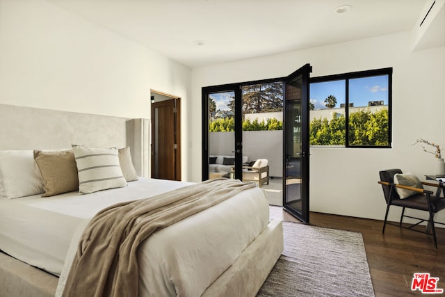 bedroom with access to outside, french doors, and dark hardwood / wood-style flooring