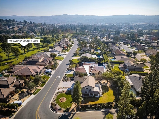 birds eye view of property with a mountain view