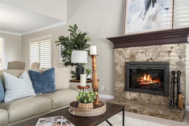 living room featuring crown molding and a high end fireplace