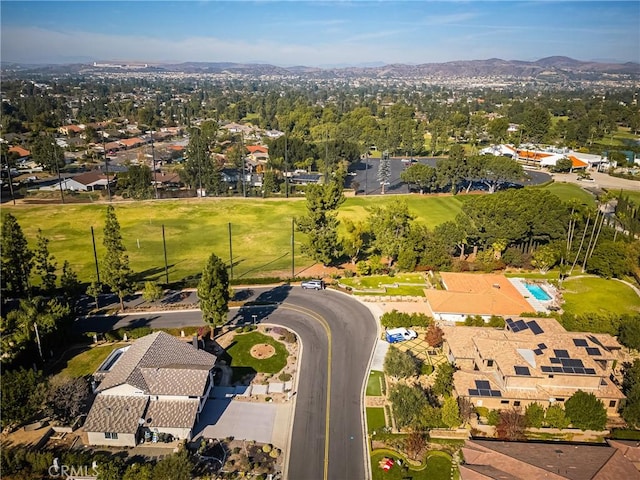 birds eye view of property featuring a mountain view