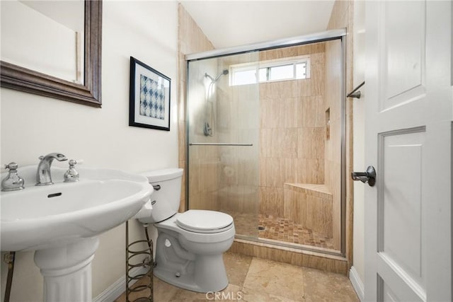 bathroom with toilet and walk in shower