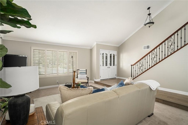 living room featuring crown molding, light hardwood / wood-style floors, and lofted ceiling