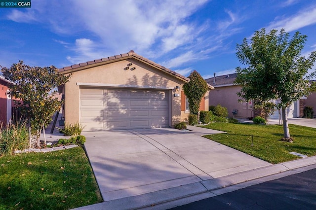 single story home featuring a garage and a front lawn