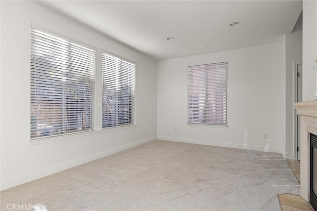 unfurnished living room with light carpet