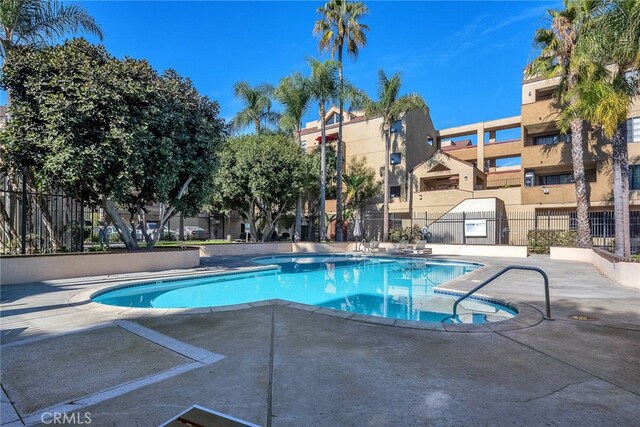 view of swimming pool with a patio