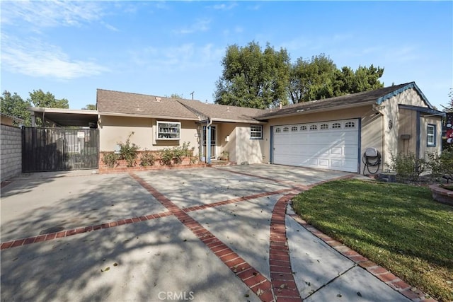 ranch-style house featuring a front lawn, a carport, and a garage