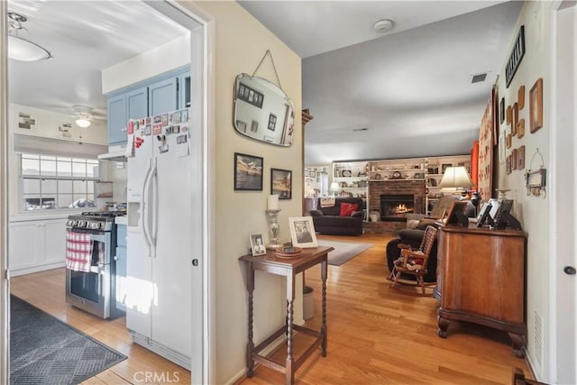 hallway with light hardwood / wood-style flooring