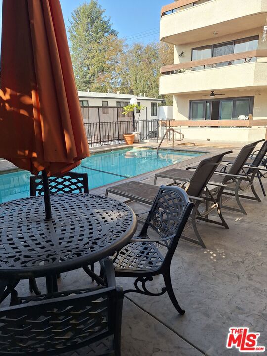 view of swimming pool with a patio area