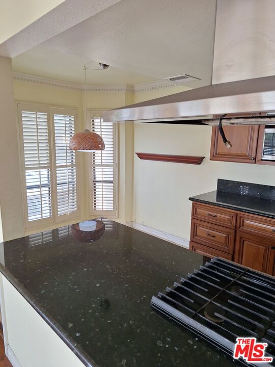 kitchen with dark stone countertops