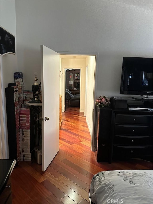 bedroom with hardwood / wood-style flooring