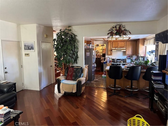 living room with dark wood finished floors and a textured ceiling