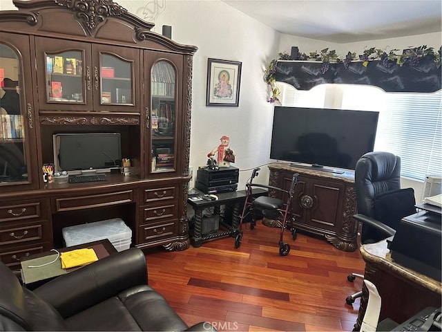 home office with wood finished floors