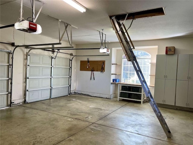 garage featuring a garage door opener