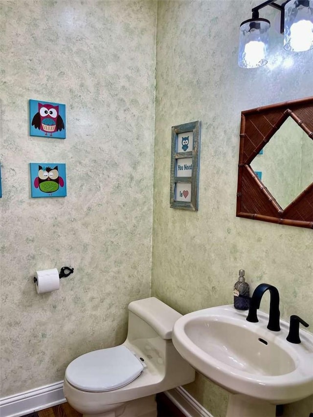 15223 Ledgewood Dr, Redding, CA 96001 - half bath with toilet, baseboards, and a sink