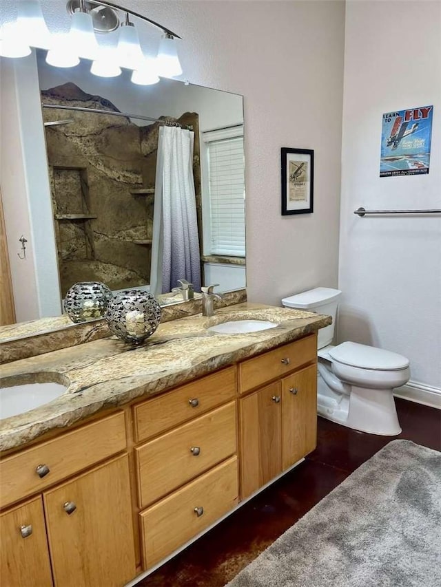 bathroom with a shower with curtain, vanity, toilet, and wood-type flooring