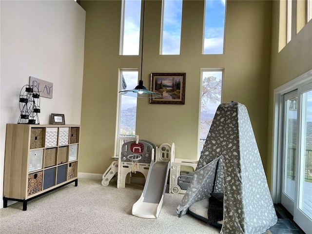 15223 Ledgewood Dr, Redding, CA 96001 - recreation room with carpet floors, a high ceiling, and baseboards