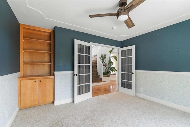 15223 Ledgewood Dr, Redding, CA 96001 - carpeted spare room featuring french doors, a ceiling fan, wainscoting, and baseboards