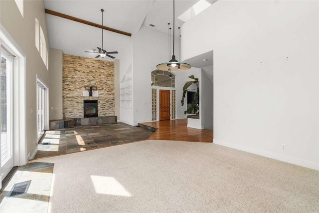 15223 Ledgewood Dr, Redding, CA 96001 - unfurnished living room featuring high vaulted ceiling, carpet, a fireplace, a ceiling fan, and baseboards