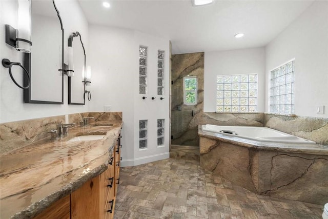 15223 Ledgewood Dr, Redding, CA 96001 - full bathroom featuring a bath, a marble finish shower, double vanity, and recessed lighting