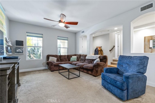 living room with light carpet and ceiling fan