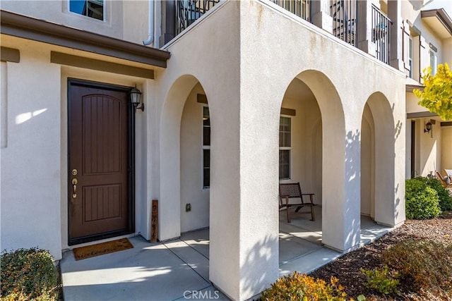 property entrance with a patio area