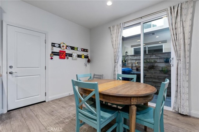 dining room with light wood-type flooring