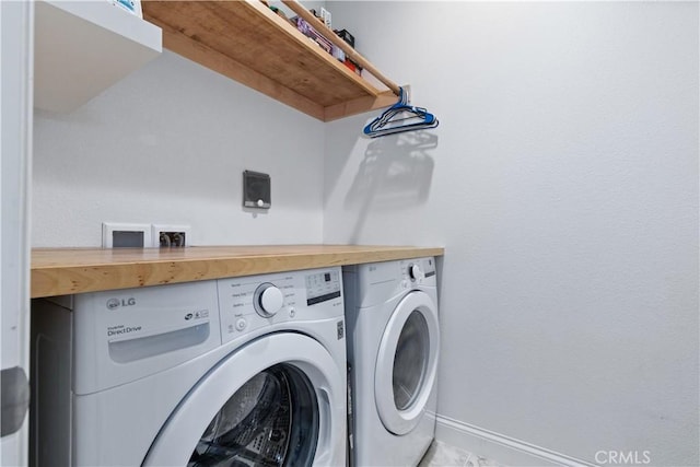 laundry room featuring washer and clothes dryer