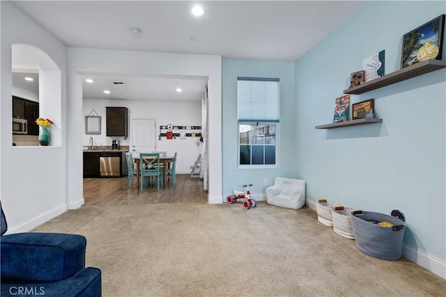 interior space with sink and carpet floors