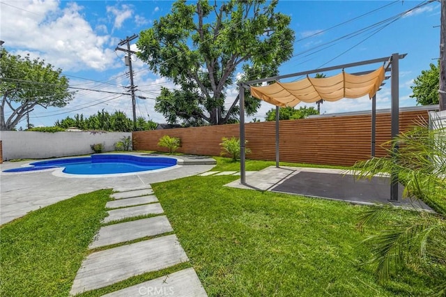 view of yard with a patio and a fenced in pool