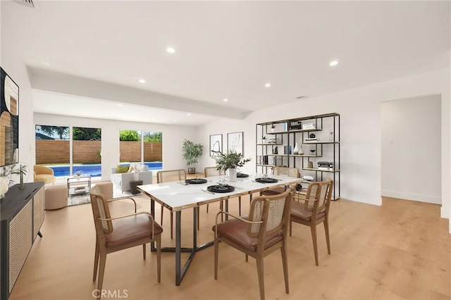 dining area with light wood-type flooring