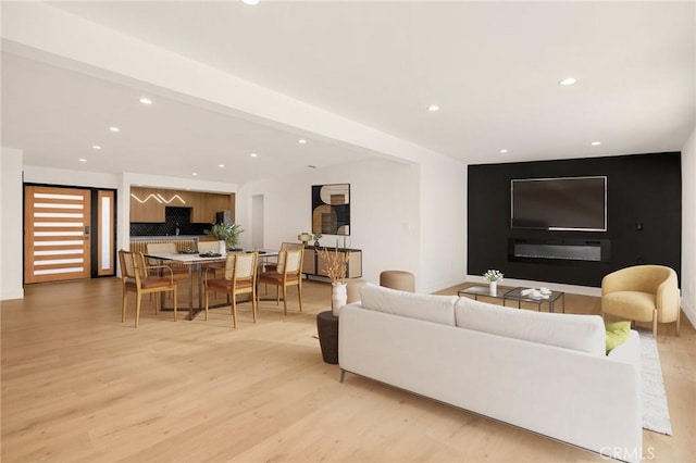 living room with light hardwood / wood-style flooring