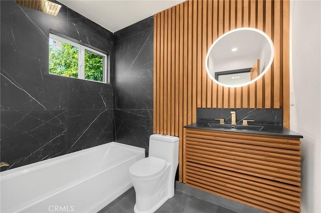 full bathroom with tile patterned floors, vanity, toilet, and tiled shower / bath combo