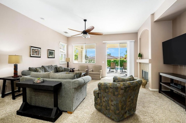 living room with light carpet and ceiling fan