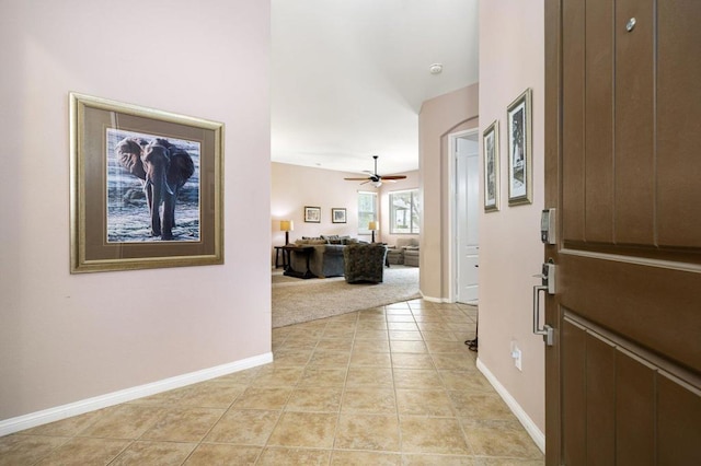 corridor with light tile patterned flooring