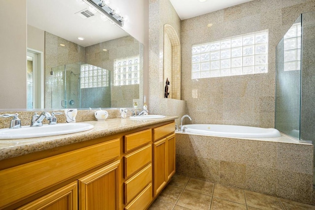 bathroom with plenty of natural light, tile patterned flooring, and shower with separate bathtub