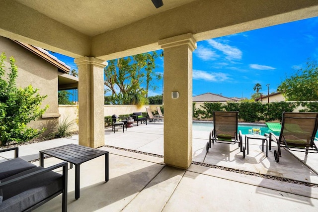 view of patio / terrace with a fenced in pool