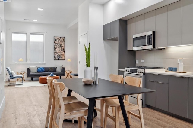 dining room with light hardwood / wood-style flooring