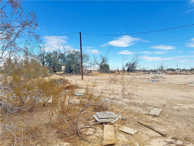 view of yard with a rural view