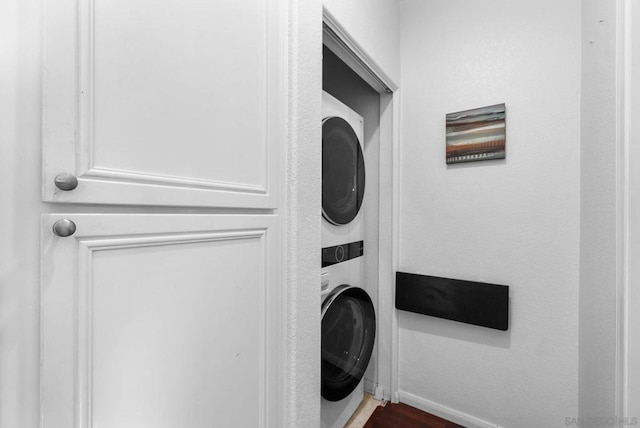 washroom with stacked washer / dryer