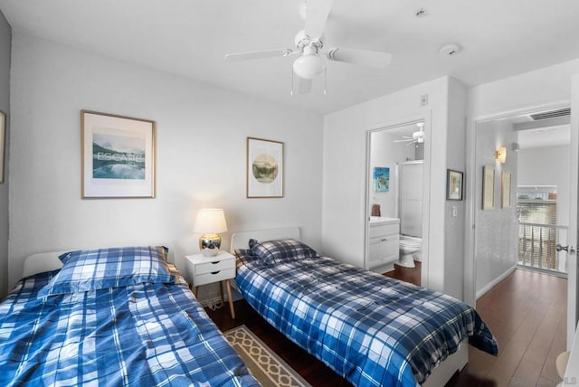 bedroom featuring dark wood-type flooring, ceiling fan, and ensuite bathroom